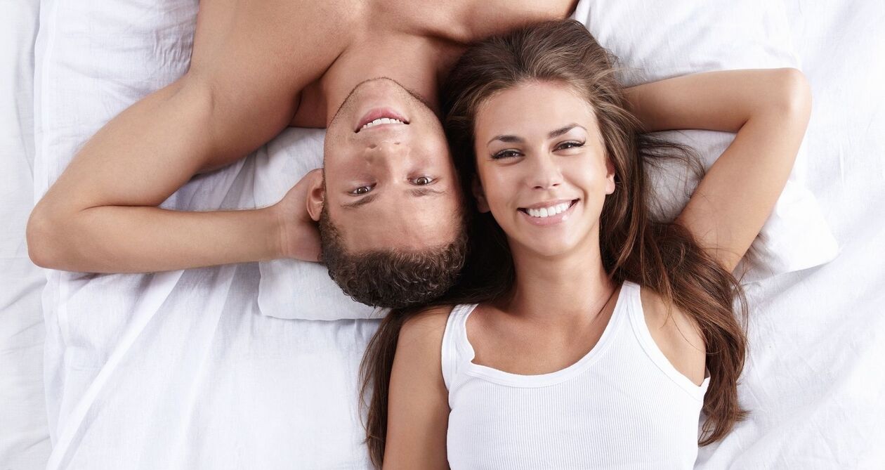 a woman in bed with a man who has increased activity